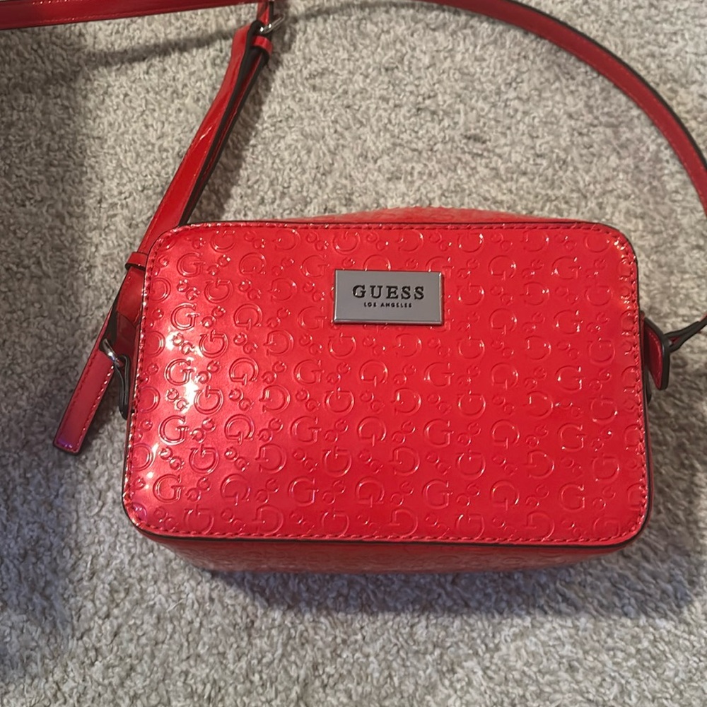 Guess red colored cross body purse